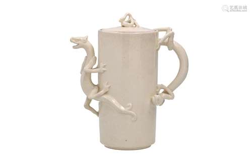 A cylindrical white glazed teapot, with spout, grip and hand...