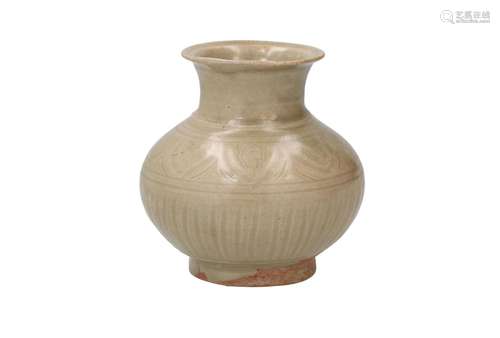 A greyish/green glazed baluster jar with incised decor of pe...