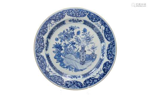 A blue and white porcelain charger, decorated with flowers a...