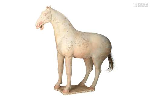 An unglazed Sichuan pottery sculpture depicting a horse. Unm...