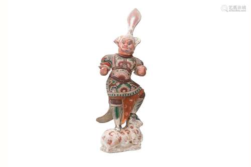 A red pottery sculpture depicting Lokopala, a guardian. Unma...