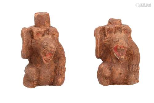 A pair of pottery sculptures depicting bears with unfired pi...