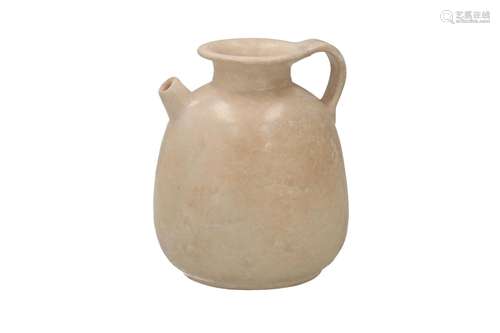 A white glazed stoneware ewer. Unmarked. China, Tang. H. 14 ...