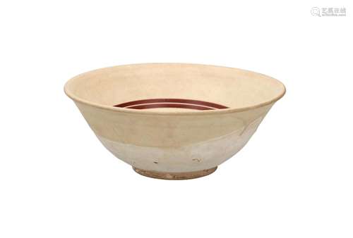 A white Cizhou earthenware bowl with slip and brown decor. U...