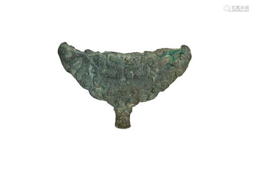 A bronze belt hook with relief decor, on plexiglass stand. C...