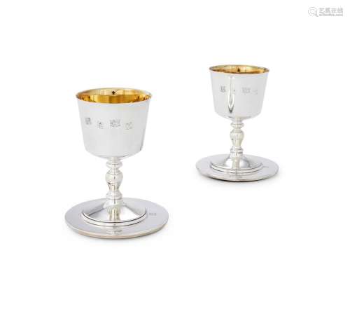A CASED PAIR OF SILVER GOBLETS AND SILVER MOUNTED COASTERS B...