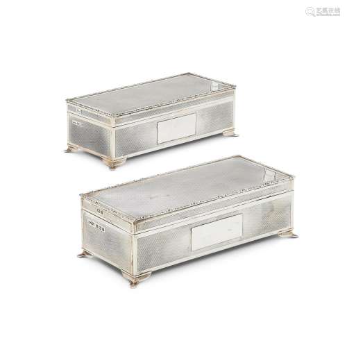 A MATCHED PAIR OF SILVER RECTANGULAR CIGARETTE BOXES BY HARM...