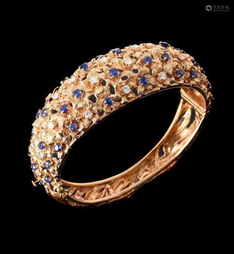 AN 18 CARAT GOLD SAPPHIRE AND DIAMOND HINGED BANGLE SIGNED V...