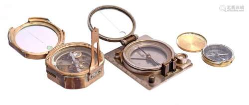 3 various compasses