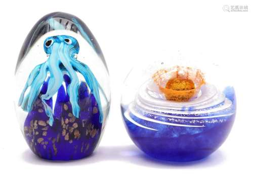 2 colored glass paperweights