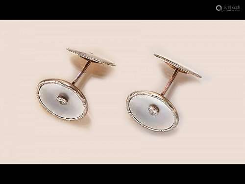 Pair of 14 kt gold cuff links with mother of pearl and diamo...