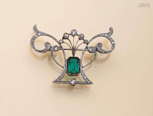 Platinum brooch with diamonds and emerald