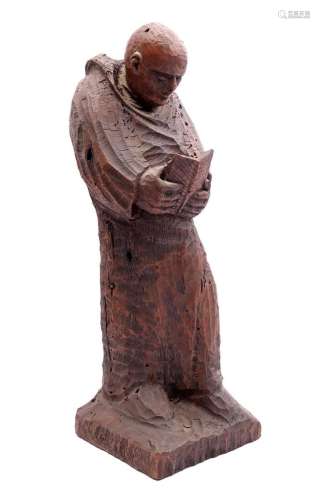 Wooden carved statue of a monk