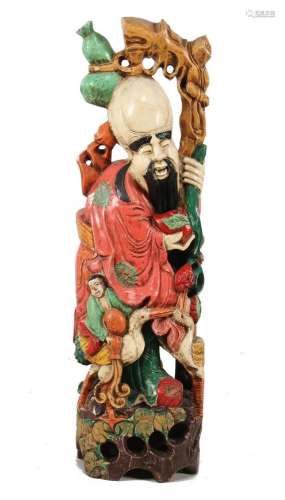 Richly carved wooden statue