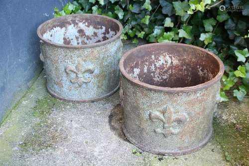 2 round cast iron flower boxes