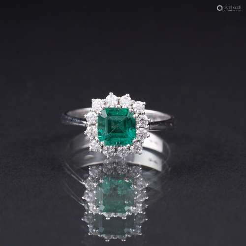 An Emerald Diamond Ring.