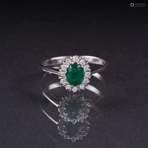 A small Emerald Diamond Ring.