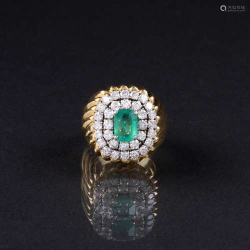 A large Emerald Diamond Ring.