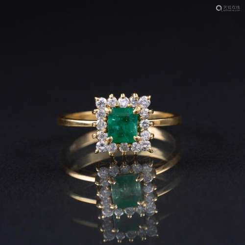 A petite Emerald Diamond Ring.
