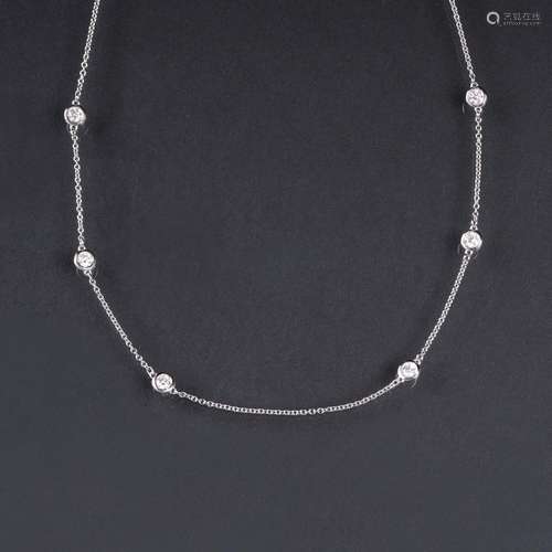 A petite Diamond Necklace.