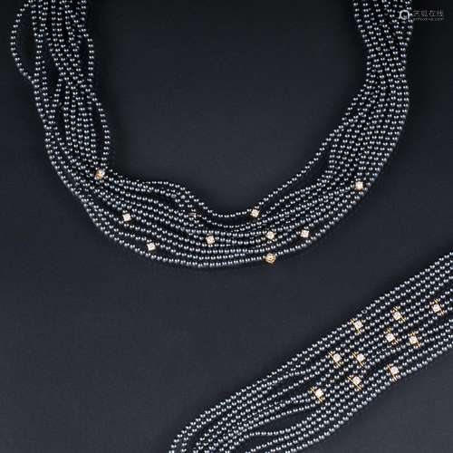 A Faux Pearl Diamond Jewellery Set with Necklace and Bracele...