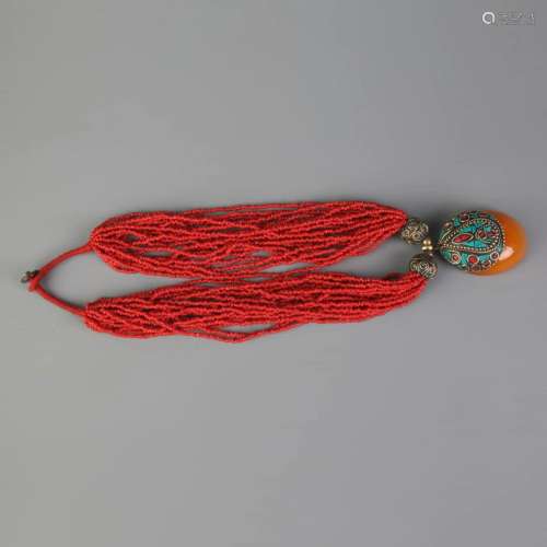 A RED CORAL WITH BEE WAX NECKLACE