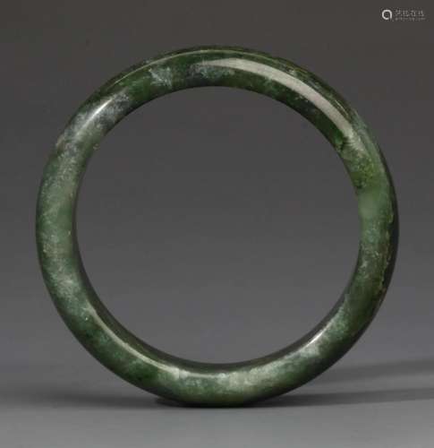 A FINE HETIAN GREEN JADE BANGLE