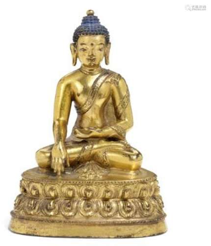 A Tibetan gilt bronze figure of Akshobhya Buddha