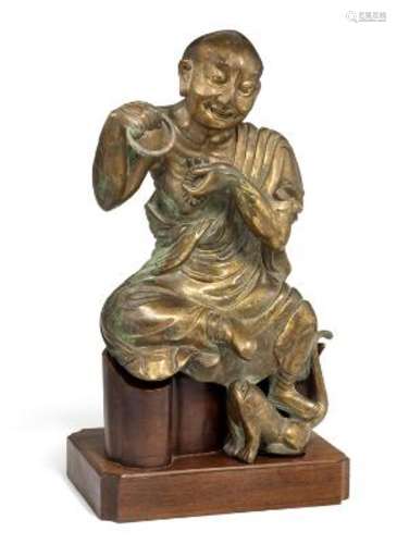 A Chinese gilt bronze figure of a Louhan, possibly Kalika