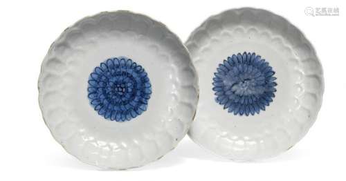 A pair of Chinese porcelain plates modelled in lotus form, d...
