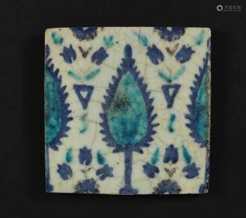 A Damascus pottery tile decorated in blue, turquoise and man...