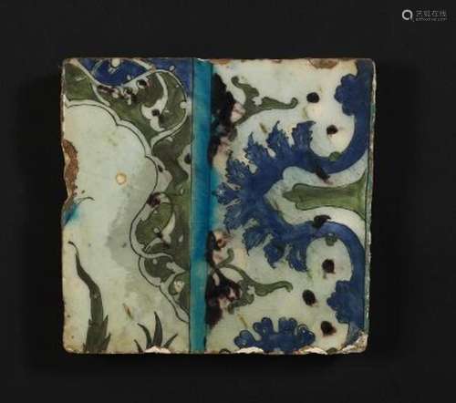 A Damascus pottery tile decorated in blue, turquoise and man...