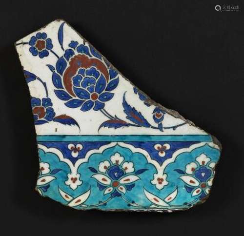 Fragment of an Iznik pottery tile decorated in blue, turquoi...