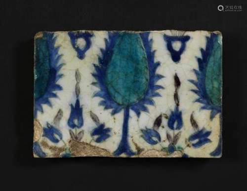 A Damascus pottery tile decorated in blue, turquoise and man...