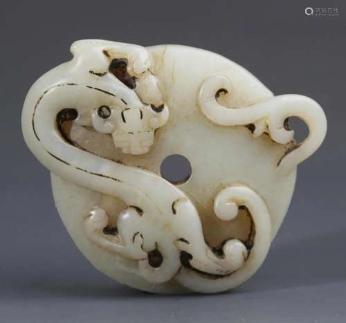 A FINE DRAGON CARVING PALE CELADON JADE PENDANT