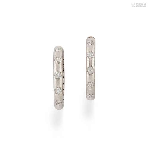 A 18K white gold and diamond earrings