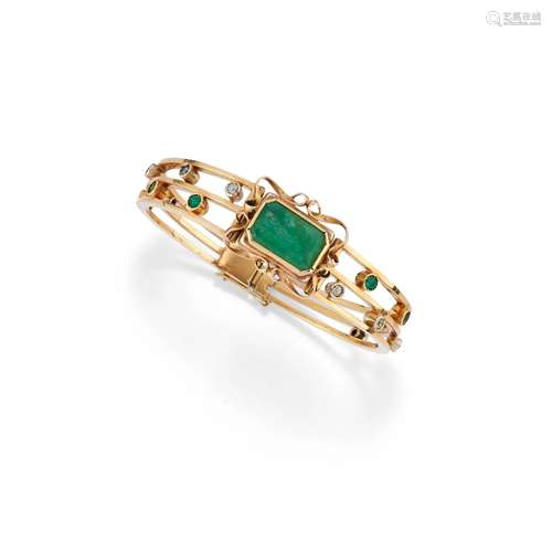 A 18K yellow gold emerald and diamond bangle, defects