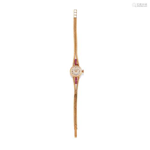 A 18K yellow gold and red stones lady's wristwatch