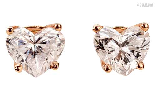 Pair of rose gold ear studs with heart-shaped diamonds