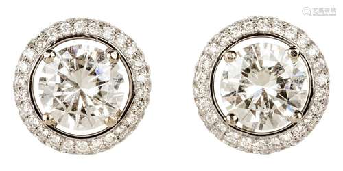 Pair of white gold solitaire diamond ear studs with jackets ...