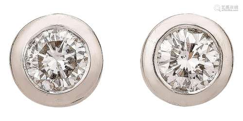 Pair of white gold ear studs with diamonds in bezel setting