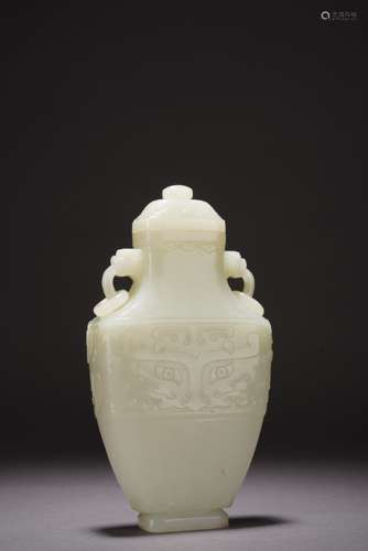 A Carved White Jade Taotie Pattern Vase and Cover