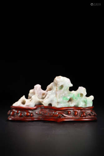 A Carved Mottled Jadeite Mountain-Form Brush Rack