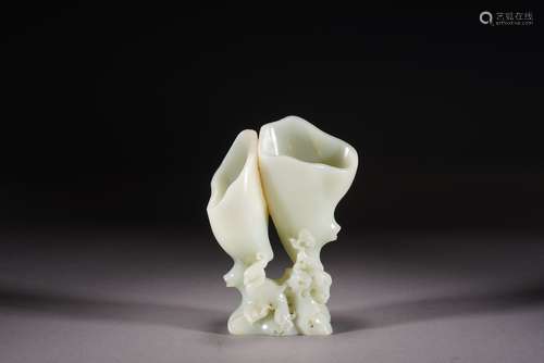 A Carved White Jade Orchid-Form Vase