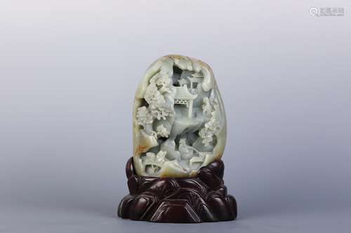 A Carved Celadon Jade Landscape and Figure Boulder