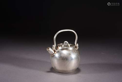 A Silver Loop-Handle Tea Pot