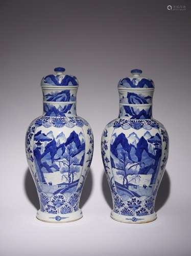 A PAIR OF CHINESE BLUE AND WHITE VASES AND COVERS KANGXI 166...