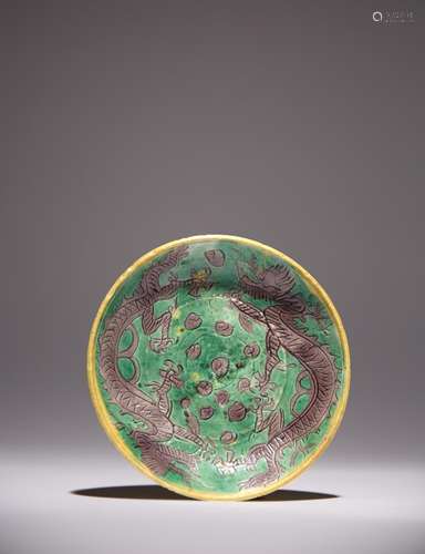 A RARE CHINESE GREEN AND AUBERGINE GLAZED DRAGON DISH TIANQI...