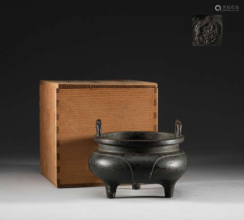 In the Ming Dynasty, a copper three legged double ear stove