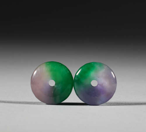 In the Qing Dynasty, a pair of jadeite buttons